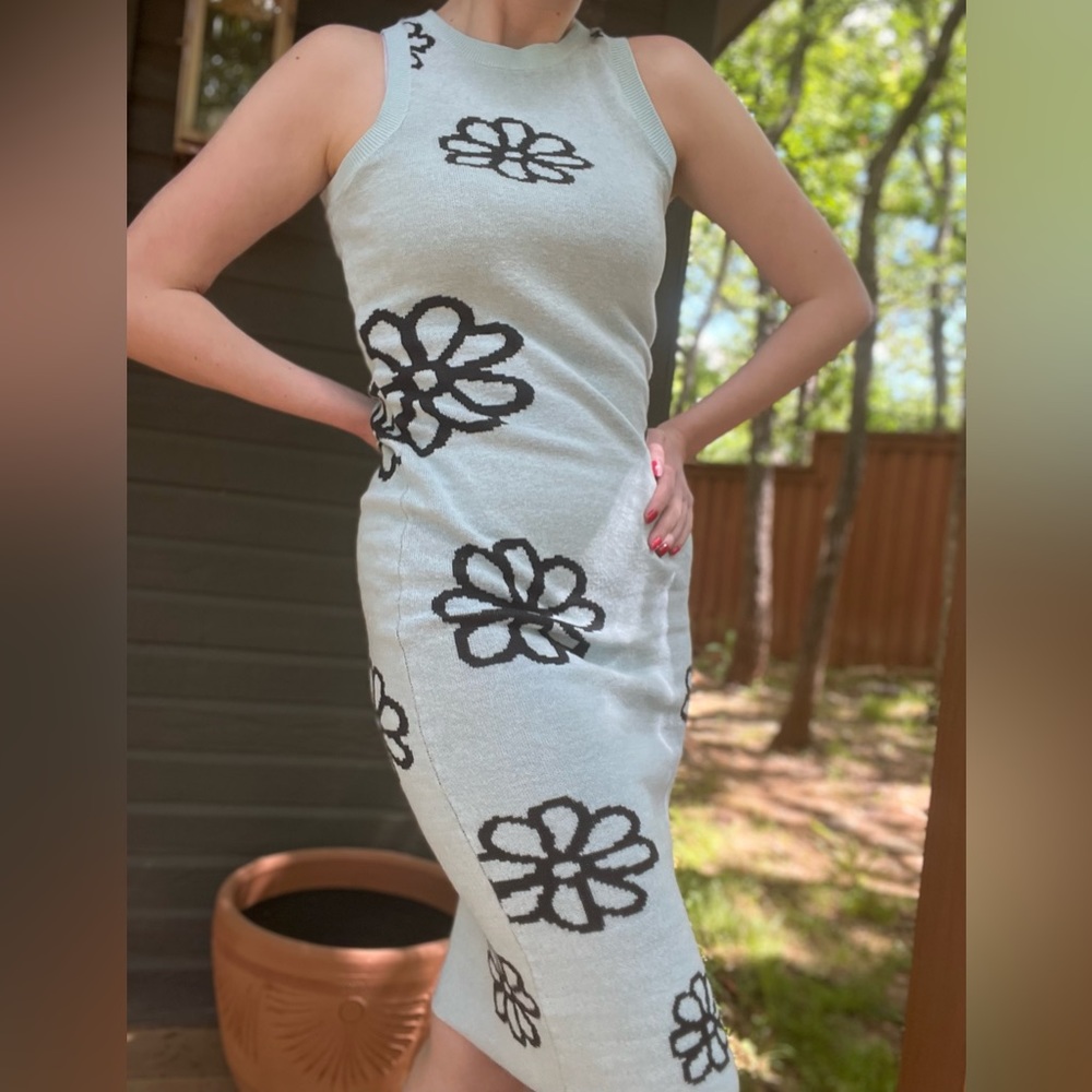 Light blue bodycon sweater dress with dark blue or teal flowers